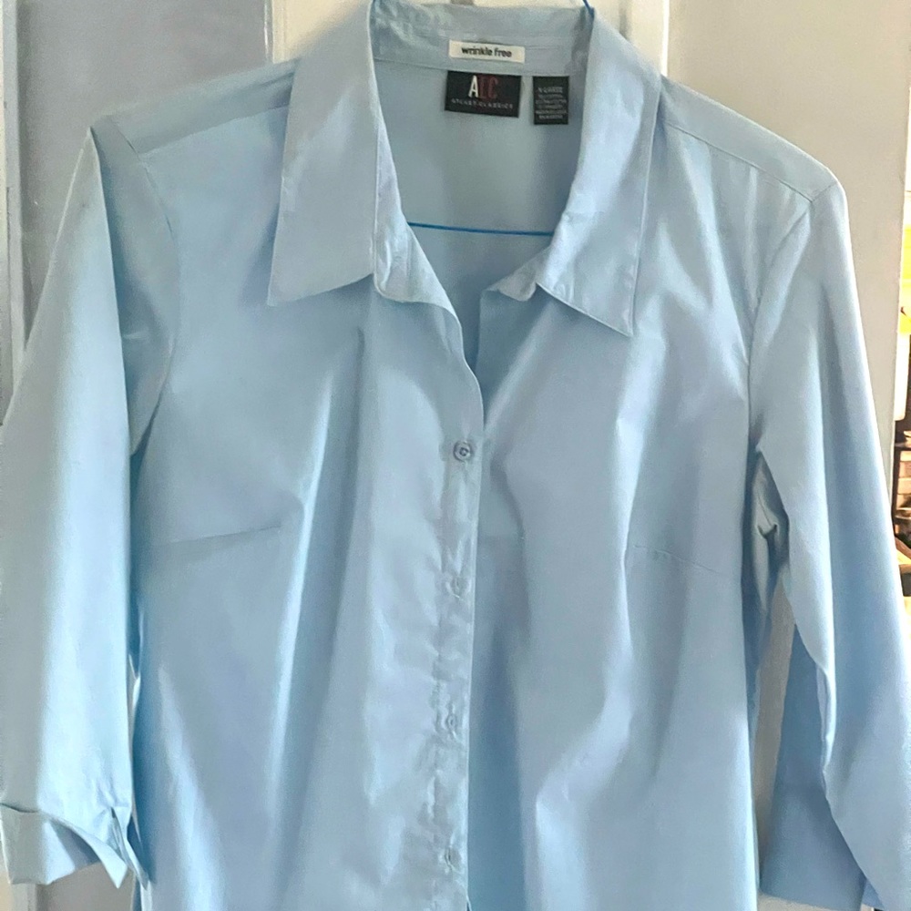 An Xl button down shirt with 3/4 sleeves.